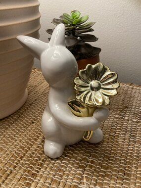 Adorable White Ceramic Bunny Holding a Bright Gold Flower